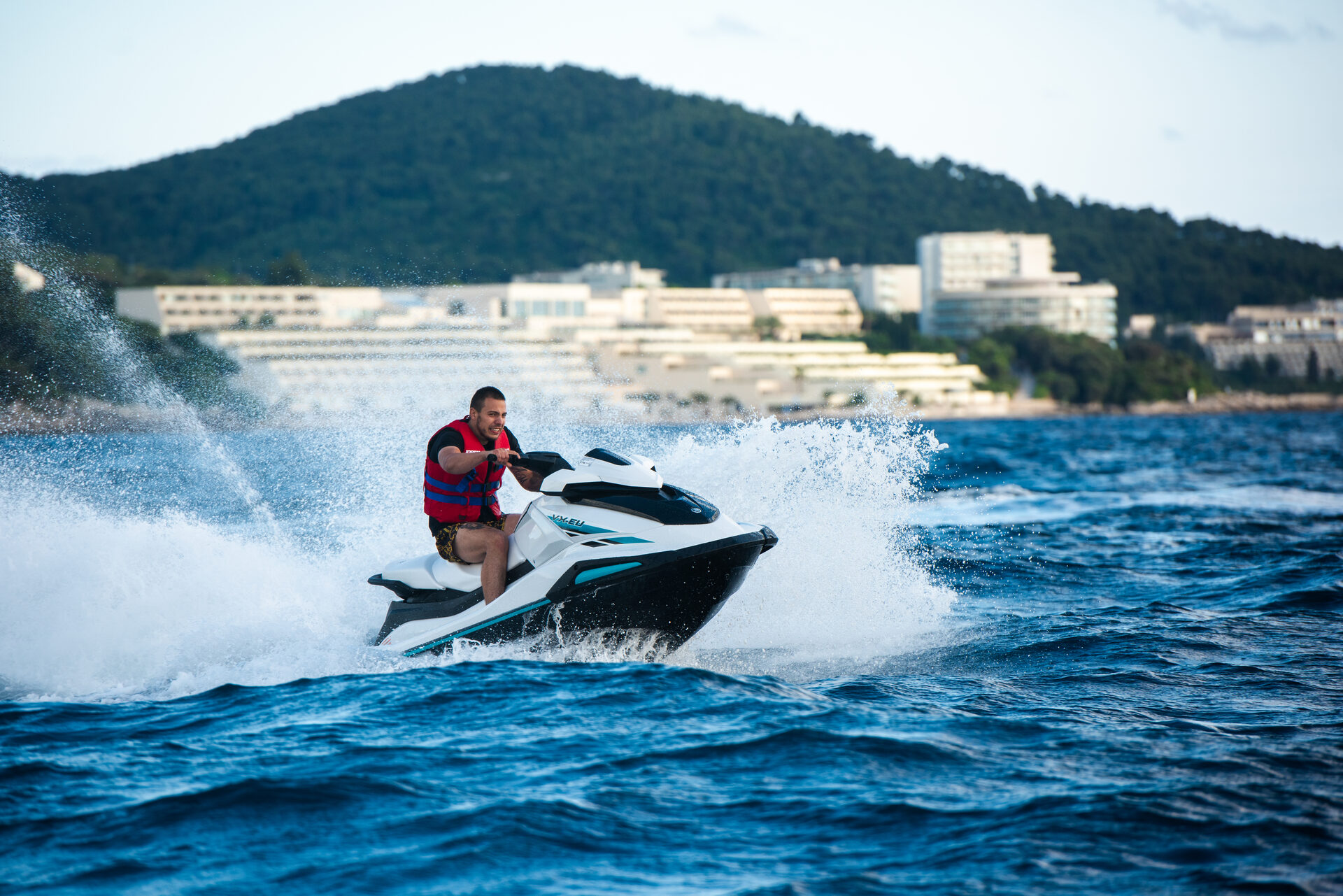 Jet ski at full speed on the Adriatic near the Dubrovnik Old City coastline